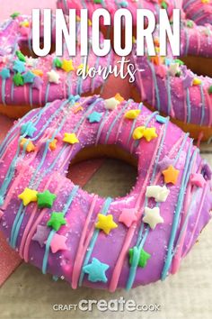 two donuts covered in pink frosting and sprinkles with the words unicorn donuts