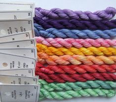 several skeins of multicolored yarn next to each other