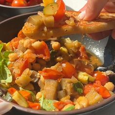 a person scooping some food out of a bowl