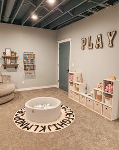 a playroom with toys and furniture in it