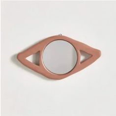 a mirror that is shaped like an eye