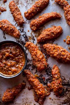 some food is laying out on a table and ready to be eaten with sauce in the middle