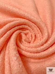 an orange fabric textured with tiny speckles