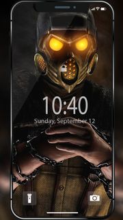 a cell phone with a gas mask on it's face and chains around the screen