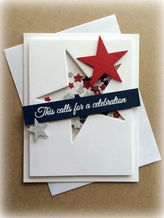 three folded cards with red, white and blue stars on the bottom one has a ribbon that says this calls for a celebration