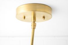 a close up of a light fixture on a white wall