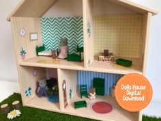 a doll house is shown with dolls in it