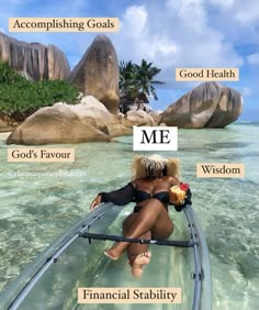 a woman sitting on top of a surfboard in the ocean with words above her