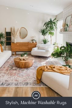 a living room filled with white furniture and lots of plants on top of the table