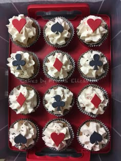 cupcakes decorated with playing cards and hearts