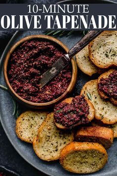 an image of homemade olive tapenad in a bowl with garlic bread on the side