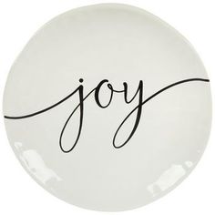 a white plate with the word joy written on it and black lettering in cursive font