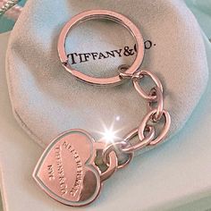 a keychain with a heart shaped tag on it