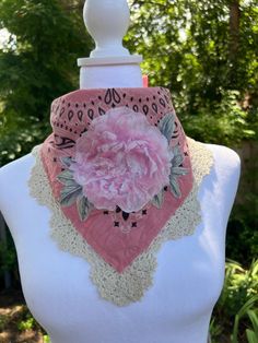 Looking for a fun accessory or gift?  This one of a kind soft distressed pink bandana is embellished with a flower applique and a lace embellished edge.  This is the perfect accessory to top off your country music concert outfit.  This embellished bandana has been tea stained and tattered slightly to give it a soft vintage vibe.  Have fun with it as it is the perfect accessory to most any boho, cowgirl chic or festival outfit.  All fabrics are sanitized before assembly. Thank you for visiting my site Vintage Bandana For Summer, Vintage One-size Bandana For Summer, Handmade Adjustable Cotton Bandana, Adjustable Handmade Cotton Bandana, Handmade Cotton Bandana For Summer, Handmade Cotton Summer Bandana, Adjustable Pink Bandana As A Gift, Adjustable Pink Bandana As Gift, Spring Adjustable Pink Bandana