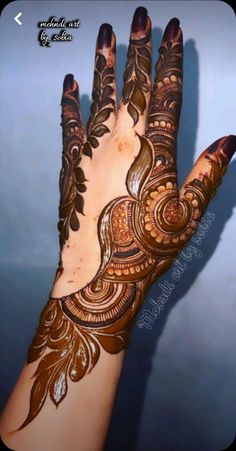 the hand is decorated with intricate designs