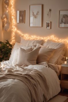 Cozy bedroom with warm fairy lights, white bedding, and framed art on the wall. Bedroom Inspirations Lights, Bedframe Lights, Mood Lighting Bedroom, Oversized Floor Lamp, Bedroom Reading Lights, Wall Mounted Reading Lights, Cozy Bedroom Lighting, Bedroom Lighting Design, Bedroom Lighting Ideas