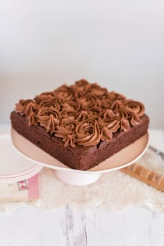 a cake with chocolate frosting is on a plate