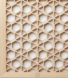 a wooden frame with geometric designs on it