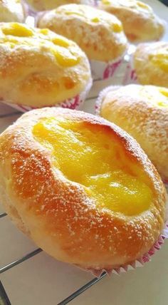 several pastries are cooling on a wire rack