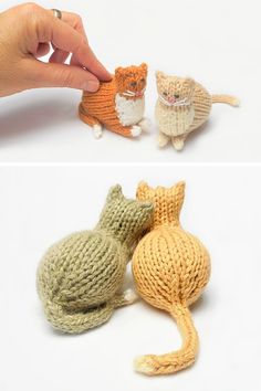 there are two small knitted cats that look like they're playing with each other