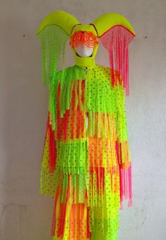 a costume made out of neon colored material