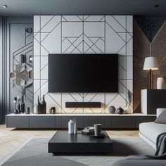 a modern living room with black and white decor on the wall, large tv mounted to the wall