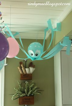 some balloons are hanging from the ceiling