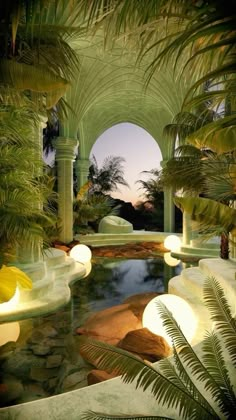 an outdoor pool surrounded by palm trees and water features lights that illuminate the light