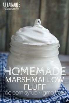 homemade marshmallow fluff in a glass jar on a blue and white towel