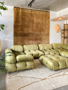 a large sectional couch sitting on top of a rug