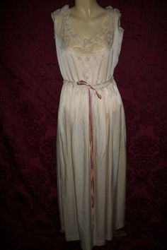 This is a antique 30s/40s long silk and lace nightgown.  It is a really pretty piece.  It is off white color and it is silk.  She has a lace insert with silky pink ribbon to tie and adjust to your waist with a tiny pearl button.   It is in good condition, the only issue I see is the lace at the top is stretched and u will have to hem it, plz see pic 4 it will give u an idea,  I believe this was on a hanger for years. Their are no tags so measurements are BUST ( underarm to underarm)- 17" across or 34" round                                                                       WAIST-15 and a half " across or 31" round I would say she fits like a medium Vintage Lace Night Dress, Babydoll Nightgown, Silk And Lace, Vintage Floral Design, Lace Nightgown, Silk Camisole, Women's Nightgowns, Lace Insert, Nightgowns