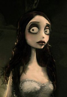 a creepy doll with big eyes and long hair