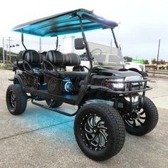 an electric golf cart is parked on the street