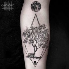 a black and white photo of a tree on the arm