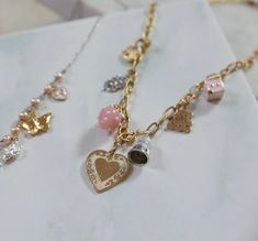 Babydoll Charm Necklace - Stone Cooper Gold Charm Necklaces With Vintage Charm In Costume Style, Vintage Gold Charms, Knife Necklace, Strawberry Charm, Daisy Charm, New Charmed, Themed Jewelry, Heart Locket, Diamond Heart