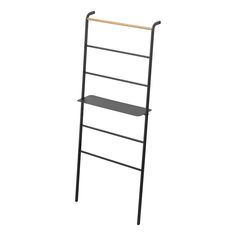 a black metal ladder with two shelves on each side