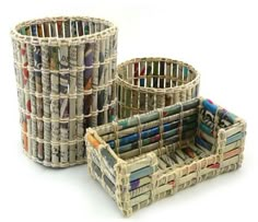 three baskets made out of newspaper are sitting next to each other