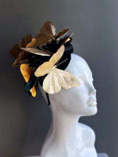 This fascinator hat features a black base decorated with delicate golden butterflies that glisten in the light, casting a radiant glow. Whether you're attending a garden party, a wedding, or a day at the races, our butterfly fascinator hat is the perfect accessory to make a statement! Age Group/Gender - Adult/Women Size/Type - One size fits all adults Color - Gold/Black Personalization - Not available Butterfly Fascinator, Masquerade Mask Costume, Mardi Gras Kid, Kids Party Packs, Ethereal Elegance, Tea Party Hats, Wedding Fascinators, Fascinator Hat, Masks Masquerade