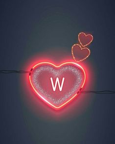 a neon heart with the letter w on it's side and two hearts in the middle