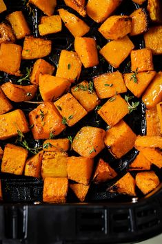 roasted sweet potatoes with herbs in a roasting pan