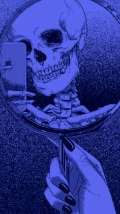 a person holding a cell phone up to their face in front of a mirror with a skeleton on it