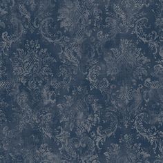 a blue and white wallpaper with an ornate design on it's surface,