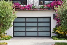 an image of a garage with flowers on the windows