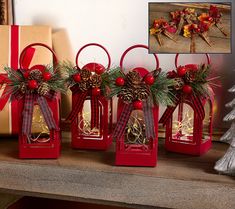 three red lanterns decorated with pine cones and bows are sitting on a mantle next to a christmas tree