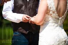 the bride and groom are getting ready to put their wedding rings on each others finger