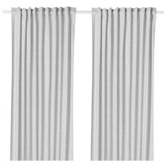 two white curtains hanging on the side of a window