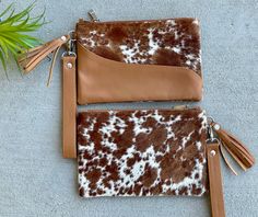 "Genuine Hair on CowhideCowhide Purse Wristlet Clutch Phone Wallet Handbag Brown Calf Leather This listing is for a beautiful wristlet designed in genuine hair on cow hide. The purse features cowhide on both sides. It features a secure zip closure and detachable strap made in real leather. The inside is cloth lined. The wristlet can either be carrier on its own or can be carried tossed inside larger bags. Measures 8.5\" wide and 5.5\" deep. Available in Brown/Tan, Black and Dark Brown colors. Yo Handmade Leather Purse, Bags 2024, Western Purses, Purse Scarf, Tote Bag Patters, Ladies Clutch, Wristlet Clutch, Cow Hide, Purse Pouch