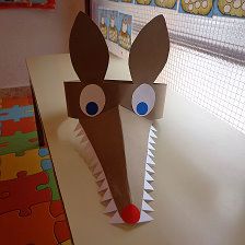 an animal made out of paper sitting on top of a counter