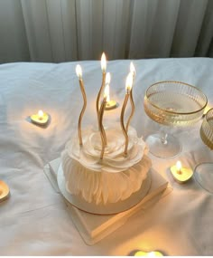 there is a cake with candles on the table