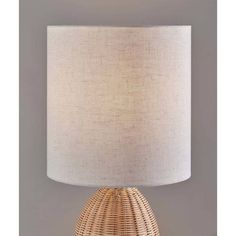 Bali Tall Table Lamp Light Rattan by Adesso Furniture Add natural texture and warmth to any room with this 24" tall Bali table lamp. It brings a touch of coastal flair to cottage décor or can be used as an organic counterpoint to a modern room. The light and natural rattan base is 7" in diameter and 11" tall. Topping the lamp is a tall crisp off-white drum shade with natural texture that softly disperses the light from a 60W bulb (not included). Use individually to illuminate your room or complete your décor by pairing this lamp with the shorter and wider version. The Bali Tall Table Lamp brings a touch of coastal flair to cottage décor or can be used as an organic counterpoint to a modern room. A light brown, natural rattan makes up the dome shaped base of the lamp. Topping the lamp is a Tall Table Lamp, Tall Table Lamps, Throw Pillow Fabric, Tall Table, Natural Mattress, Mirror Lamp, Mattress Box Springs, Black Floor Lamp, Arc Floor Lamps